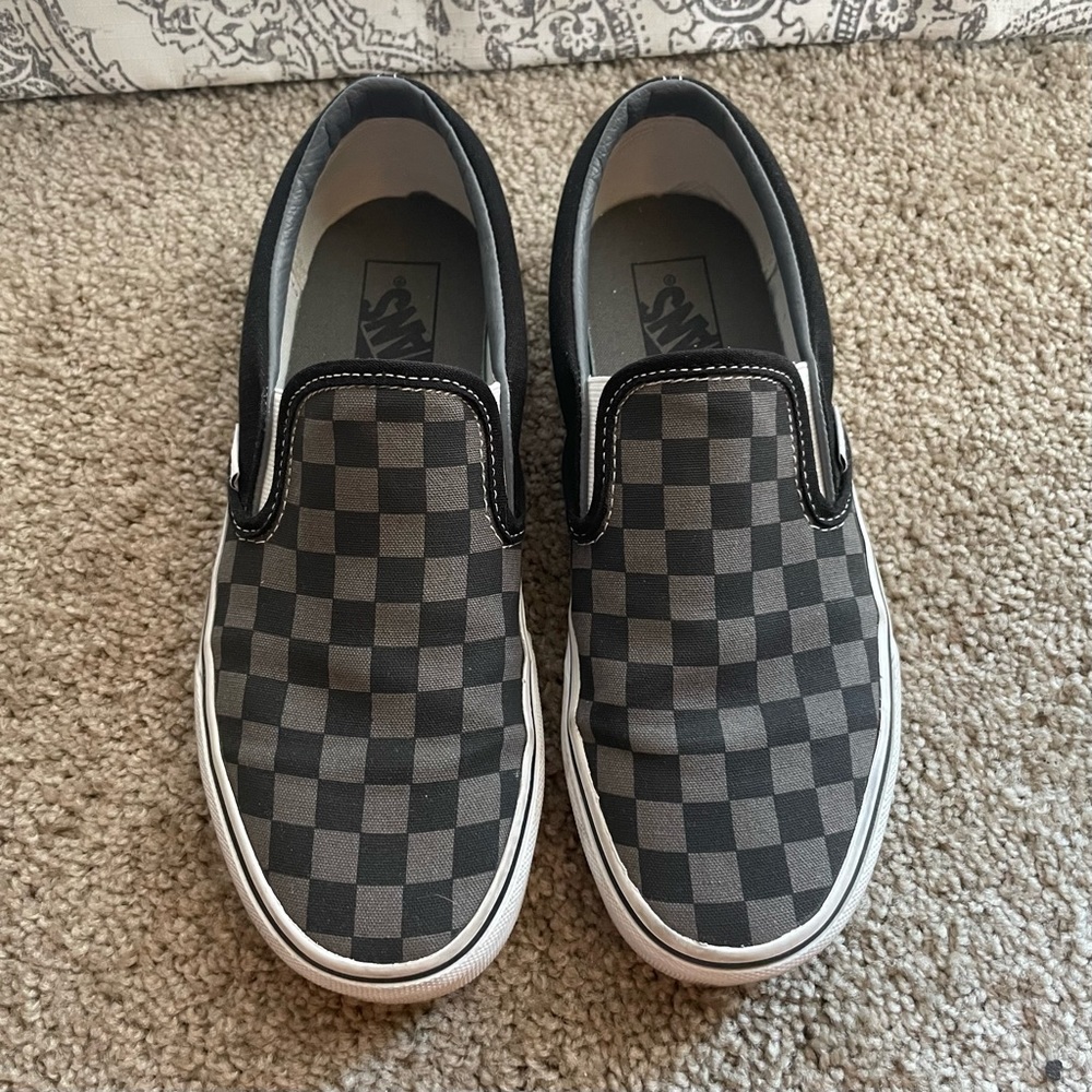 Black and grey checkered slip-on Vans